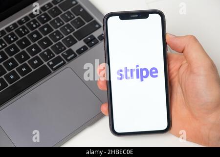 Stripe crypto wallet logo on the screen of mobile phone and notebook on the background, November 2021, San Francisco, USA. November 2021, San Francisco, USA Stock Photo