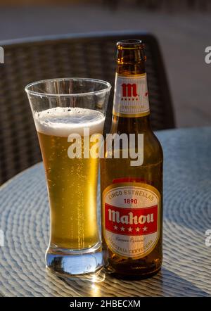 Glass and bottle of Mahou Cinco Estrellas 1890 cerveza especial beer, Maestria Cervecera, Spain Stock Photo