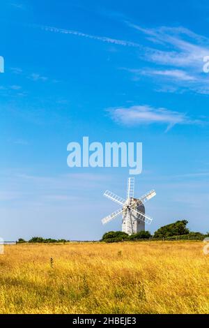 White wooden windmill in a field - Ashcombe Windmill in Kingston near Lewes, South Downs National Park, England, UK Stock Photo