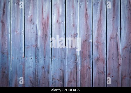Blue and purple wood background with weathered planks with fading colors Stock Photo