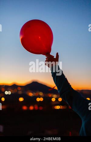 Hand Releasing Balloon Stock Photo Alamy
