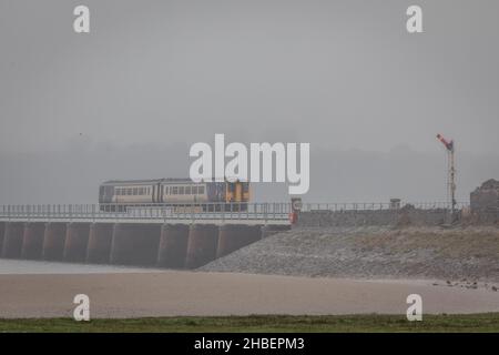 BR Class 156 'Super Sprinter' No. 156463 crosses Kent viaduct at Arnside, Cumbria Stock Photo