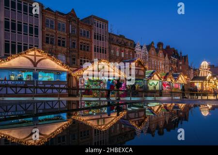 Nottingham Christmas Market and festive attractions in the city centre. The Christmas tree in Old Market Square point for the city’s Christmas events. Stock Photo