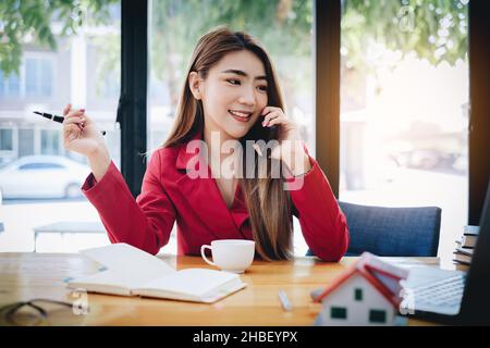 A young asian lady excited when product sale. woman using shopping application on tablet. online shopping concept. Stock Photo