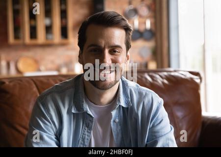 Head shot smiling handsome young man looking at camera. Stock Photo