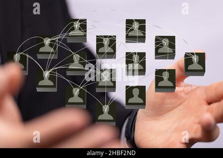 An abstract shot of male hands displaying contact icons connecting, networking in digital cyberspace Stock Photo