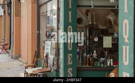 Antique street shop with old, vintage items in New Westminster. Vintage objects and furniture for sale in antique store. Stock Photo