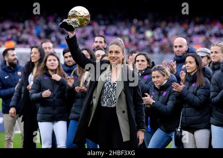 BARCELONA - DEC 4: Alexia Putellas lifts her Ballon d'Or Feminin trophy prior to the La Liga match between FC Barcelona and Real Betis Balompie at the Stock Photo