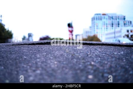 Crack in Asphalt Driveway Stock Photo