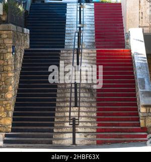 Blue, white and red French flag on a staircase in Valbonne on the French Riviera Stock Photo