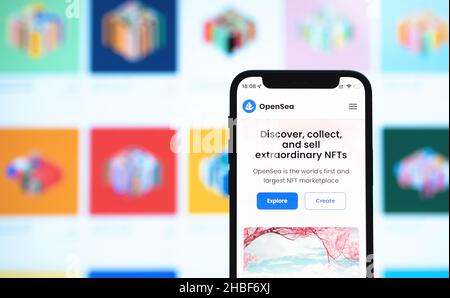 Kharkov, Ukraine - December 17, 2021: OpenSea marketplace for NFT selling. Website with logo closeup on mobile phone screen. Concept of cryptoart, dig Stock Photo