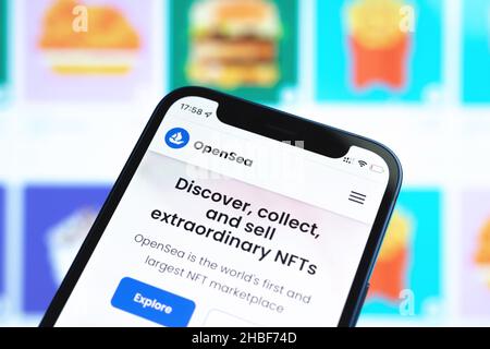 Kharkov, Ukraine - December 17, 2021: OpenSea logo and website on a mobile phone screen. Selling NFT cryptoart, digital arts and collectibles Stock Photo