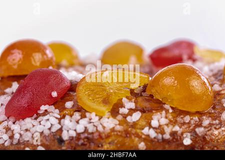 Detail of cake of the kings, brioche with candied fruits for the Epiphany on white background Stock Photo