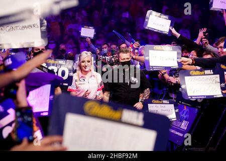 Fallon Sherrock during her walk on before her match against Steve Beaton during day five of the William Hill World Darts Championship at Alexandra Palace, London. Picture date: Sunday December 19, 2021. Stock Photo