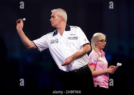 Steve Beaton throwing during his match against Fallon Sherrock during day five of the William Hill World Darts Championship at Alexandra Palace, London. Picture date: Sunday December 19, 2021. Stock Photo