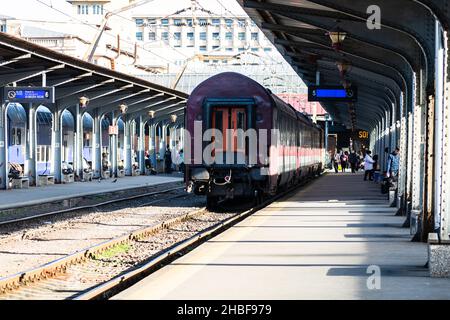 BUCHAREST, ROMANIA - Dec 04, 2021: A view of a train in motion or at the platform at Bucharest North Railway Station (Gara de Nord Bucharest) Romania, Stock Photo