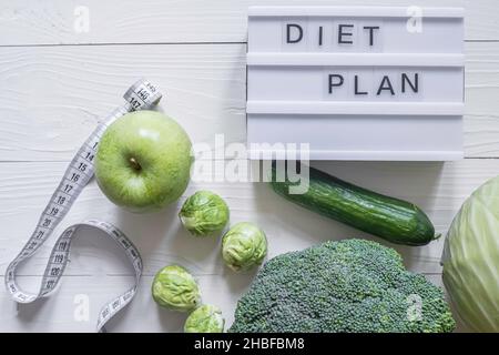Concept diet and slimming plan with vegetables top view  Stock Photo