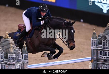 Royal Victoria Dock, United Kingdom. 19th Dec, 2021. London International Horse Show. Excel London. Royal Victoria Dock. Martin Fuchs (SUI) riding CONNER JEI during Class 16 - The Longines FEI Jumping World Cup. Credit: Sport In Pictures/Alamy Live News Stock Photo