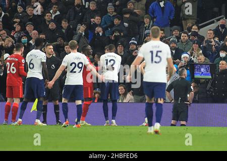 Referee Paul Tierney looks closely at the VAR monitor before he sends off Andrew Robertson of Liverpool (26) after a foul on Emerson Royal of Tottenham Hotspur. Premier League match, Tottenham Hotspur v Liverpool at the Tottenham Hotspur Stadium in London on Sunday 19th December 2021. this image may only be used for Editorial purposes. Editorial use only, license required for commercial use. No use in betting, games or a single club/league/player publications. pic by Steffan Bowen/Andrew Orchard sports photography/Ģ����ý Live news Stock Photo