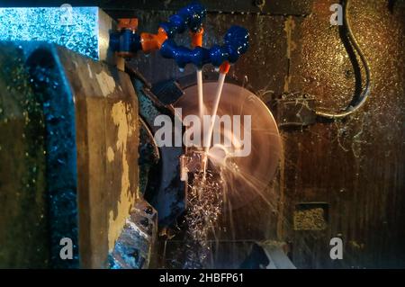 Metal cutting blanks on a multi-purpose CNC machine with different tools Stock Photo