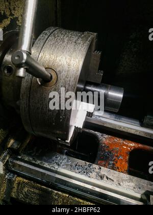 Metal cutting blanks on a multi-purpose CNC machine with different tools Stock Photo