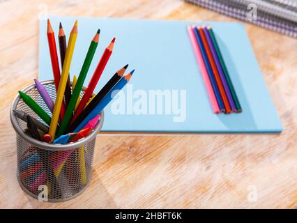 Colored pencils kept in pencil holder Stock Photo