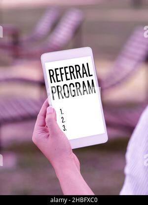 Sign displaying Referral Program. Concept meaning sending own patient to another physician for treatment Voice And Video Calling Capabilities Stock Photo