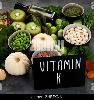 Foods high in vitamin K on dark background. Healthy diet concept. Stock Photo