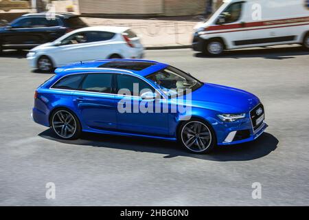 Kiev, Ukraine - June 19, 2021: Blurred car. CAR OUT OF FOCUS. Blue Audi RS6 Avant in motion Stock Photo