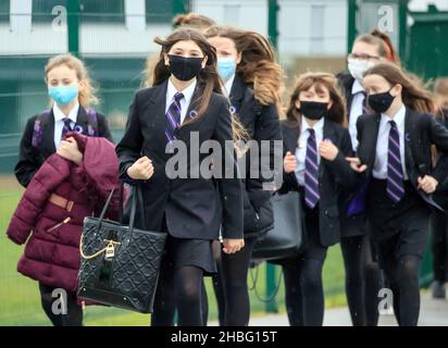 File photo dated 08/03/21 of students arriving at Outwood Academy in Woodlands, Doncaster in Yorkshire. Education Secretary Nadhim Zahawi has called on ex-teachers to sign up from Monday to help with Covid-19 staff shortages in the new year. Former teachers who are available to return to the classroom should apply on the Get Into Teaching website, he said, ideally starting the process before Christmas Eve to be ready to join the workforce from January. Issue date: Monday December 20, 2021. Stock Photo