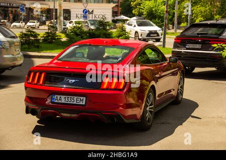Kiev, Ukraine - June 12, 2021: Red muscle car Ford Mustang in the city Stock Photo