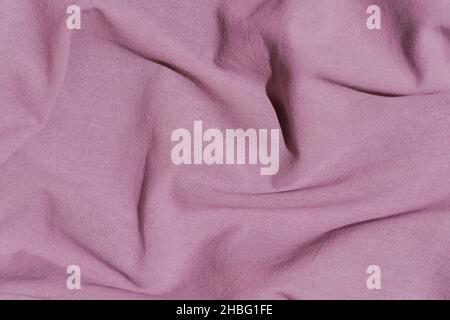 Fabric cotton background. Folds, texture and draperies on the surface textile of garment warp, upholstery and design. High quality photo Stock Photo