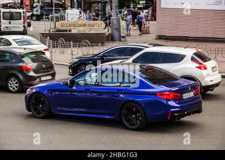 Kiev, Ukraine - June 12, 2021: Blue BMW M5 on the road Stock Photo