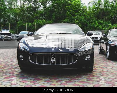 Kiev, Ukraine - May 14, 2011: Black supercar Maserati Grancabrio in the city Stock Photo