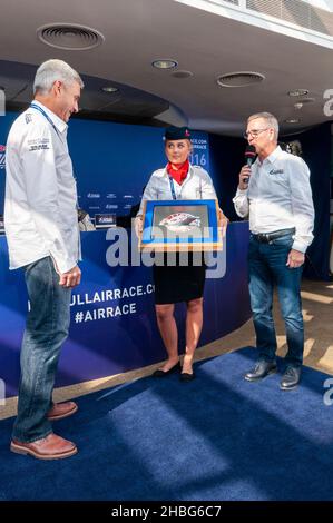 Pilot Paul Bonhomme presented with a commemorative gift from the Red Bull Air Race team following the racing at Royal Ascot racecourse Stock Photo