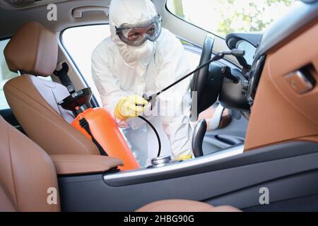 Portrait of worker use car interior steam cleaner. Vapor sterilization  Stock Photo - Alamy