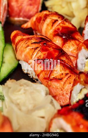 Closeup of nigirizushi with seared salmon and unagi sauce served in sushi set Stock Photo