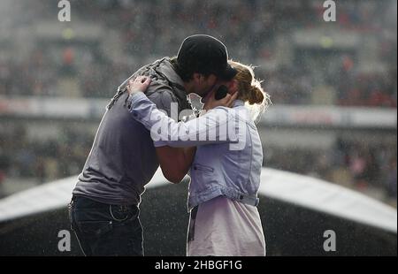 Enrique Iglesias with fan Sophie Elphick on stage during Capital FM's Summertime Ball at Wembley Stadium, London. Stock Photo