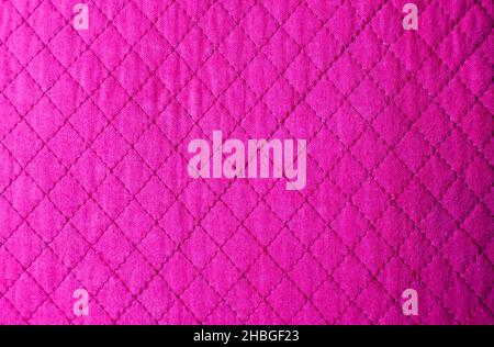 A fuchsia texture with diamond pattern. background for fashion themed graphic resources. Stock Photo