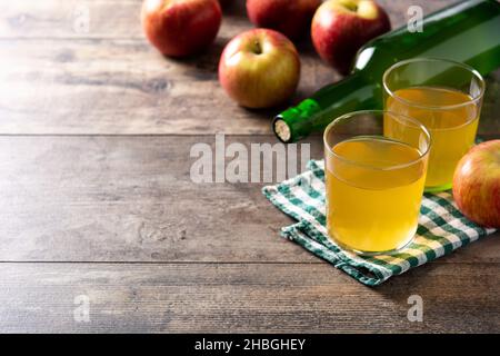 Apple cider drink on rustic wooden table Stock Photo