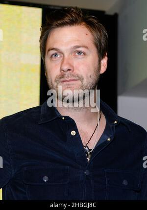 Tom Meighan of the band Kasabian during a signing of the bands new album 'Velociraptori' at HMV, Oxford Street, London Stock Photo