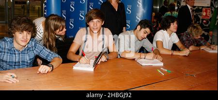 (L-R) Liam Payne,Zayne Malik,Harry Styles,Niall Horan and centre Louis Tomlinson of One Direction,X Factor teen heartthrobs sign copies of their new book, Dare To Dream at WH Smith's,Westield,North West London, Stock Photo