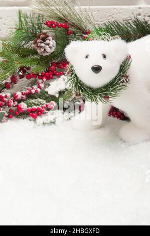 Christmas background with polar bear and christmas tree branches and snow Stock Photo