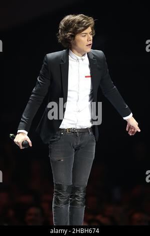 Harry Styles of One Direction performs during the 2013 Brit Awards at the O2 Arena, London. Stock Photo