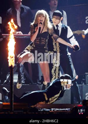 Taylor Swift performs on stage at the 2013 Brit Awards at the O2 Arena, London. Stock Photo