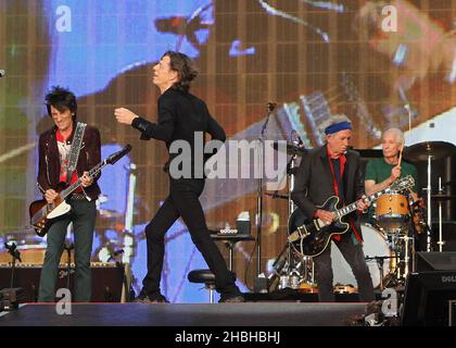 Ronnie Wood, Mick Jagger, Keith Richards and Charlie Watts of The Rolling Stones perform on stage at Barclay Summer Time iHyde Park on Saturday in London. Stock Photo