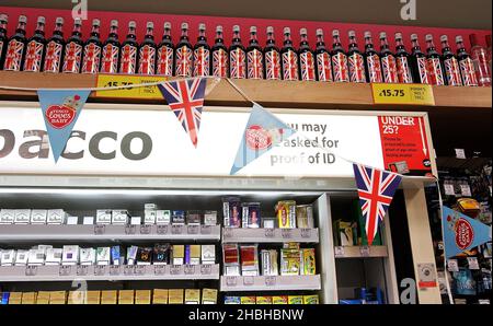 Local Food and Wine Store at Great Portland Street with Flags celebrating the Royal Baby Birth in London. Stock Photo