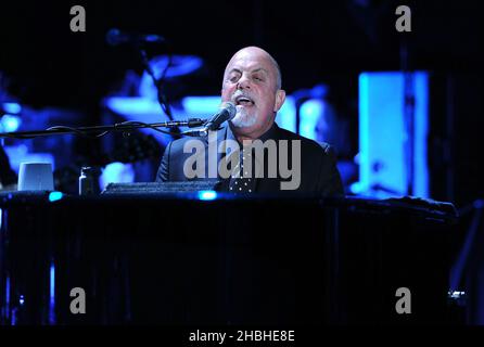 Billy Joel performs on stage at the piano at the Eventim Hammersmith Apollo in London. Stock Photo