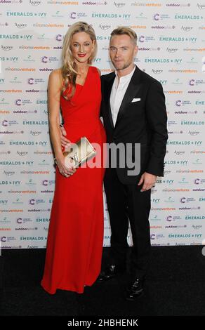 Ronan Keating and girlfriend Storm Uechtritz arrive at the Emeralds and Ivy Ball at Old Billingsgate in London Stock Photo