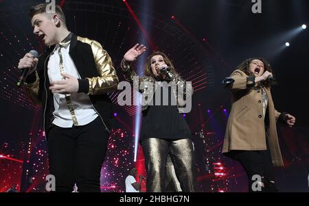 Nicholas McDonald,Sam Bailey and Luke Friend perform on stage at Wembley Arena during the X Factor 2014 live tour in London. Stock Photo